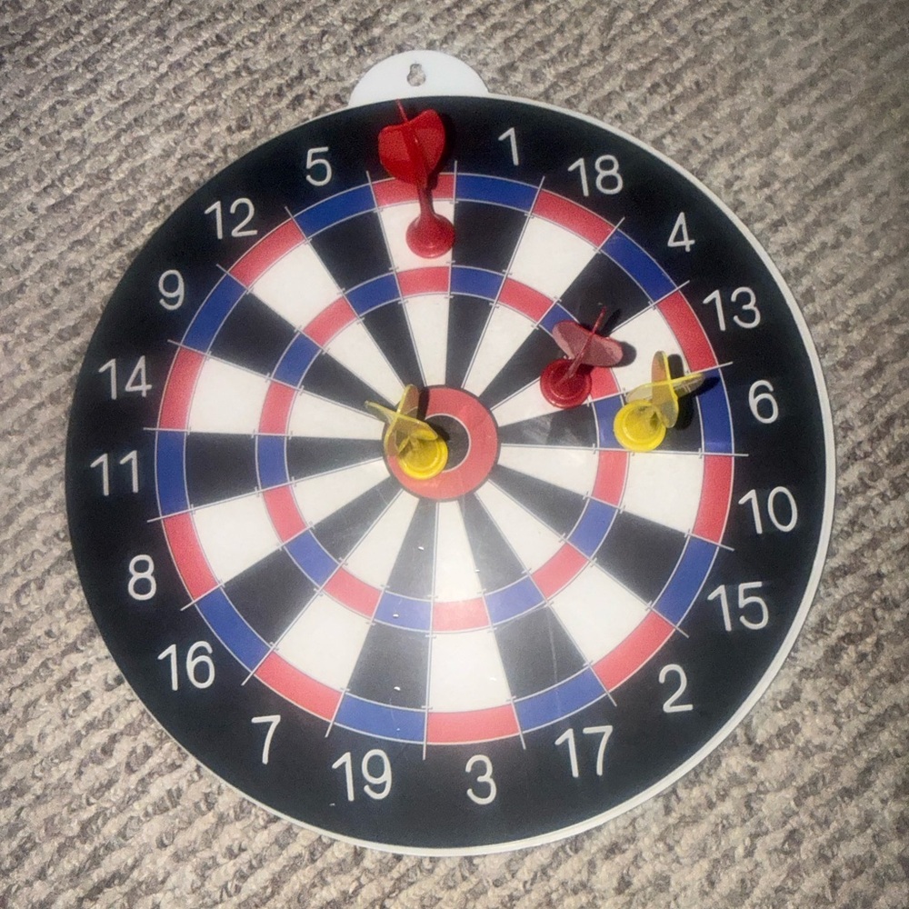 Brookstone combo magnetic darts and ring toss game. Hook to hang on the wall.